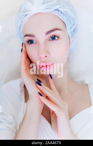 Hardware skin care. A young girl cares for her face. Beauty treatment. Procedures. Advertising. Stock Photo