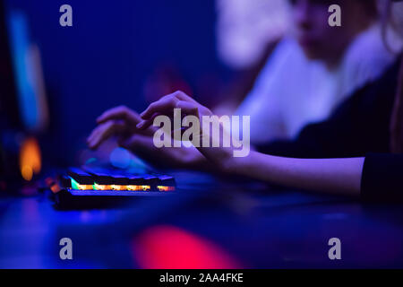 Hacker uses keyboard, shakes buttons with fingers to crack password. Internet security concept, cyber attack. Stock Photo