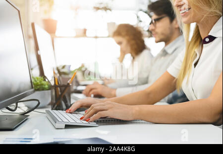 Group of people working on computers close up Stock Photo