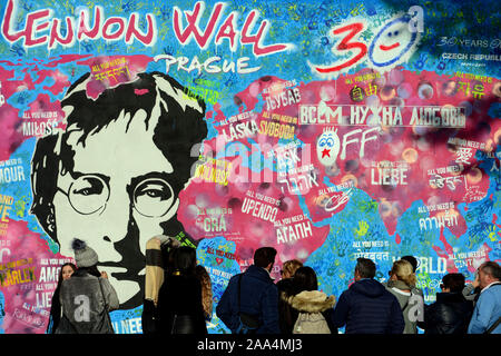 Prague, Czech Republic. 16th Nov, 2019. Prague's Lennon wall painted from 30 artists from five countries. Last weekend marks the 30th anniversary of the Velvet Revolution. The Lennon Wall represented not only a memorial to John Lennon and his ideas for peace, but also a monument to free speech and the non-violent rebellion of Czech youth against the regime. It was a small war of Czech people against the communist police who cleaned the wall. On 17 November 2014, the 25th anniversary of the Velvet Revolution, the wall was painted over in pure white by a group of art students, leaving only th Stock Photo