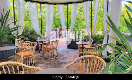 interior design, wicker chairs on the terrace, garden Stock Photo