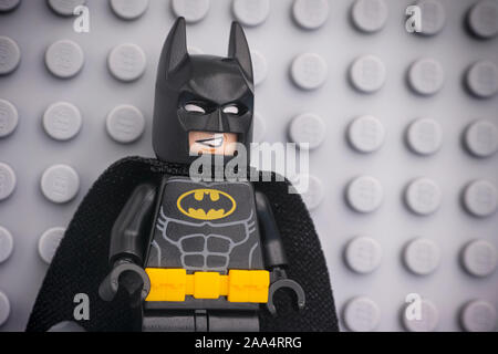 Tambov, Russian Federation - November 08, 2019 Portrait of Lego Batman minifigure standing against Lego gray baseplate background. Stock Photo