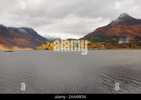 Loch Leven facing towards Invercoe Village and the Snow Topped Pap of Glencoe with the Loch in the foreground Stock Photo