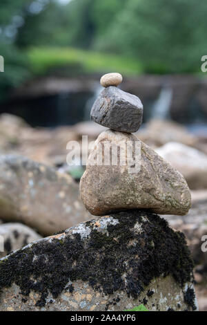 Stone stacking at Wainwath Falls in the Yorkshire Dales National Park, UK. Stock Photo