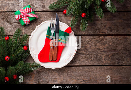 Christmas table setting on wooden table Stock Photo