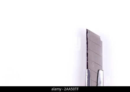 Tip of a stationery knife. Blade close up on a white background isolated. Stock Photo