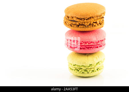 Three Fresh Colorful Macaroons Isolated on White Background. Stock Photo