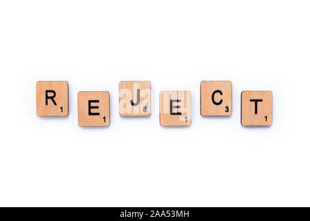 London, UK - June 13th 2019: The word REJECT, spelt with wooden letter tiles over a white background. Stock Photo