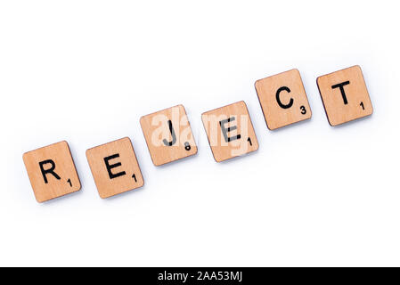 London, UK - June 13th 2019: The word REJECT, spelt with wooden letter tiles over a white background. Stock Photo