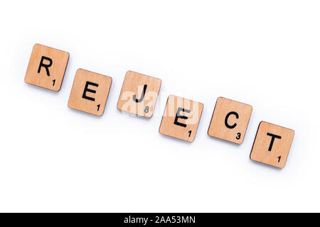 London, UK - June 13th 2019: The word REJECT, spelt with wooden letter tiles over a white background. Stock Photo