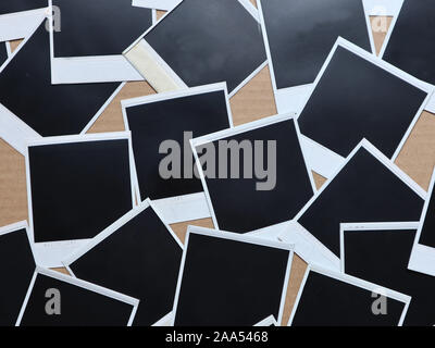 Set of retro photo frames Many polaroid on a cardboard background Vintage Pictures . Top view. Flat lay Stock Photo