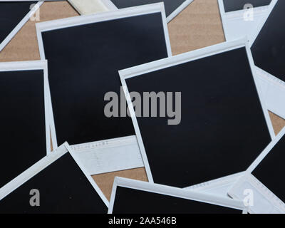 Set of retro photo frames Many polaroid on a cardboard background Vintage Pictures . Top view. Flat lay Stock Photo
