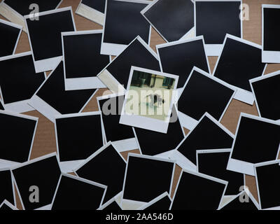 Set of retro photo frames Many polaroid on a cardboard background Vintage Pictures . Top view. Flat lay Stock Photo