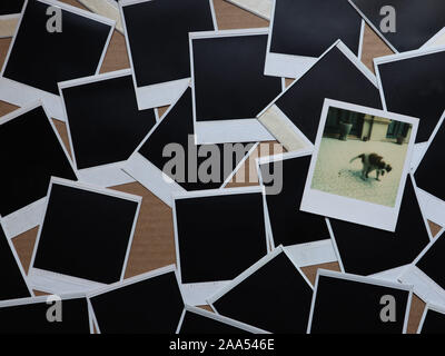 Set of retro photo frames Many polaroid on a cardboard background Vintage Pictures . Top view. Flat lay Stock Photo