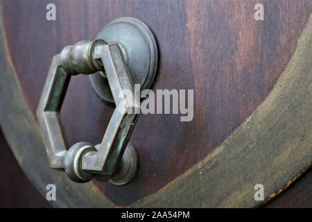 closed old rusty padlock on a wooden door Stock Photo