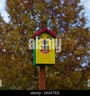 Nesting box with face painted on it Stock Photo