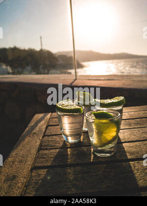 Tequilla on beach side Mykonos, Greece during summer Stock Photo