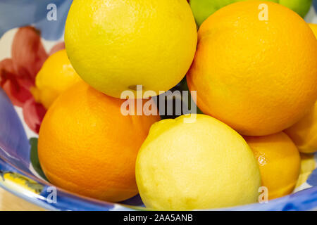 Large bowl of lemons and oranges in a kitchen Stock Photo