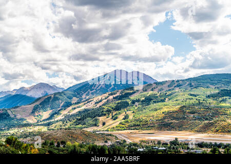 Aspen, Colorado rocky mountains wide angle view of storm clouds and small airport runway in roaring fork valley Stock Photo