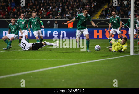 19 November 2019, Hessen, Frankfurt/Main: Soccer: European Championship qualification, group stage, group C, 10th matchday, Germany - Northern Ireland in the Commerzbank Arena. Germany's Leon Goretzka (18) scores the goal against Northern Ireland goalkeeper Bailey Peacock-Farrell. IMPORTANT NOTE: In accordance with the requirements of the DFL Deutsche Fußball Liga or the DFB Deutscher Fußball-Bund, it is prohibited to use or have used photographs taken in the stadium and/or the match in the form of sequence images and/or video-like photo sequences. Photo: Christian Charisius/dpa Stock Photo