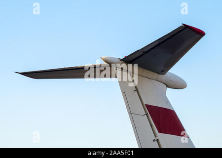 part tail of a soviet airliner close up isolated on a blue sky background Stock Photo