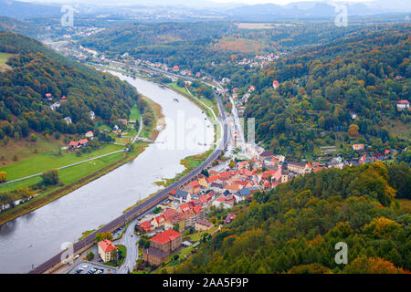 Aerial view of the river Elbe and Konigstein and several small villages, surrounded by forests in autumn colours. Konigstein is a small town in Saxony Stock Photo