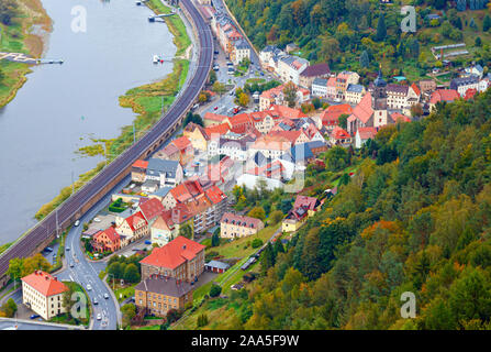 Aerial view of the river Elbe and Konigstein town centre, surrounded by forests in autumn colours. Konigstein is a small town in Saxony, Sachsische Sc Stock Photo