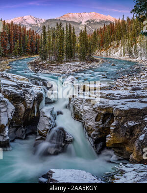 Panoramic format photo of the early winter scene at Sunwapta Falls on the Icefields Parkway, Jasper National Park, Alberta, Canada sunset, of the Sunw Stock Photo