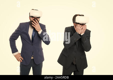 Testing new technologies. modern technology in agile business. businessmen wear VR glasses. mature men with beard in suit. Digital future and innovation. virtual reality. Partnership and teamwork. Stock Photo