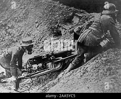 New German machine gun. German machine gunners getting one of their new weapons into position on the firing line. The photo was found on one of the captured enemy photographers ca. 1917-1918 Stock Photo