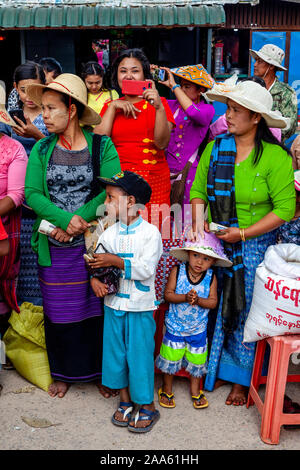 Local People Wait To Give Alms and Money To Monks About To Take Part In A Procession, The Pindaya Cave Festival, Pindaya, Shan State, Myanmar Stock Photo