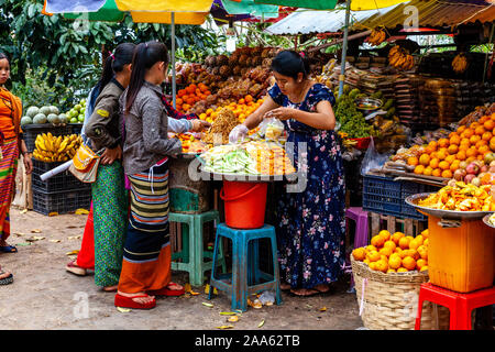 Young Women Buying Fruit In The Market, Pindaya, Shan State, Myanmar. Stock Photo