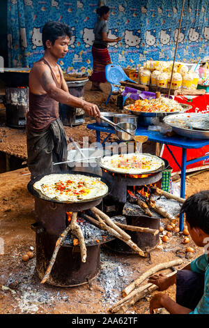 A Burmese Man Making Pizzas In The Market, Pindaya, Shan State, Myanmar. Stock Photo