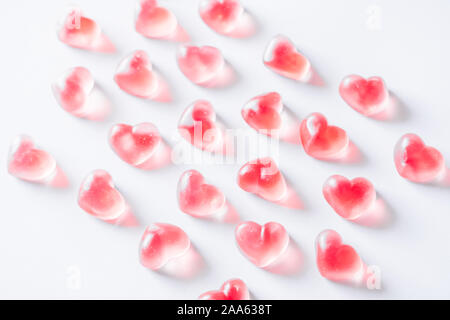 Pink heart shaped gummies pattern. Stock Photo