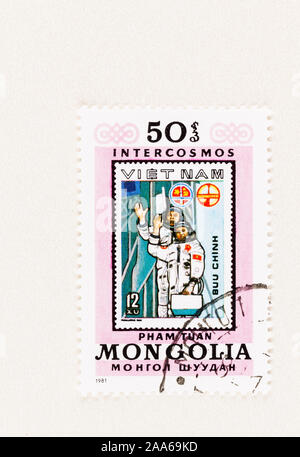 SEATTLE WASHINGTON - October 5, 2019: 1981 Mongolia stamp featuring a former Vietnam postage stamp commemorating cosmonauts and space exploration. Stock Photo