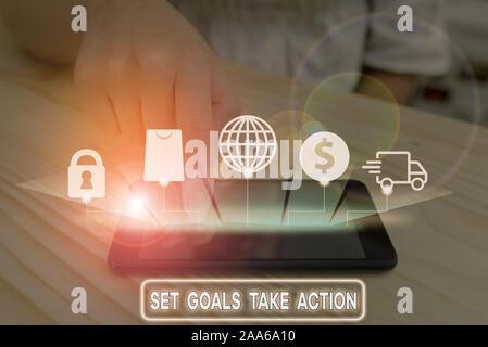 Writing note showing Set Goals Take Action. Business concept for Act on a specific and clearly laid out plans Stock Photo