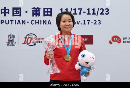 Putian, China's Fujian Province. 20th Nov, 2019. Zhang Jingjing of China poses during the awarding ceremony after the women's 25m pistol final at the ISSF World Cup Final in Putian, southeast China's Fujian Province, Nov. 20, 2019. Credit: Lin Shanchuan/Xinhua/Alamy Live News Stock Photo