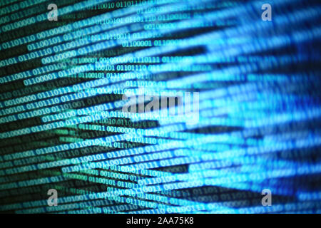 power of big data. binary code information bit on computer monitor screen display. Led light text number one and zero. blur defocus blue white bokeh l Stock Photo