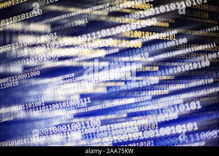 power of big data. binary code information bit on computer monitor screen display. Led light text number one and zero. blur defocus blue white bokeh l Stock Photo