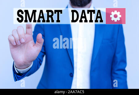 Handwriting text Smart Data. Conceptual photo digital information that is formatted for further consolidation Businessman in blue suite and white shir Stock Photo
