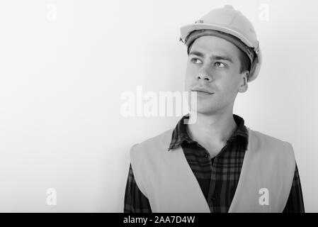 Portrait of young handsome man construction worker in black and white Stock Photo