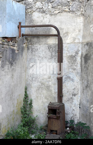 Old Rusty Wood Stove or Wood-Burning Stove Stock Photo