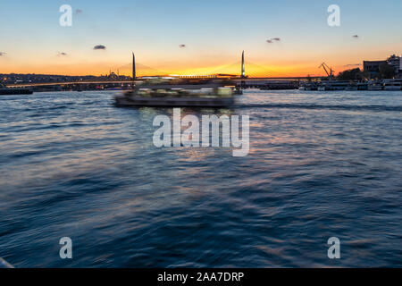 ISTANBUL, TURKEY - JULY 27, 2019:  Sunset view of Ataturk Bridge and Golden Horn in city of Istanbul, Turkey Stock Photo