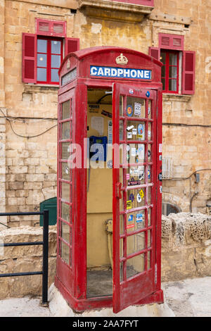 Valletta, Malta - October 10, 2019: Iconic red phone booth in capital city, London-style phone box Stock Photo