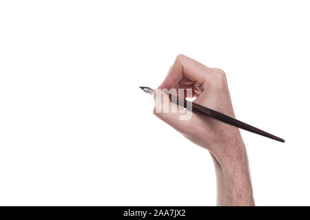 hand with pen antique writing isolated over white background Stock Photo