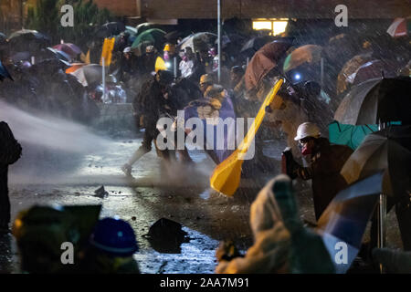 Hong Kong, China. 18th Nov, 2019. Pepper water from water canons sprayed at students during the protests.Siege at Polytechnic University. Police surround the university campus after pro-democratic protesters blocked the cross-harbour tunnel and the major road outside the campus. Hong Kong protest continue for the sixth months. A citywide strike called for started on Monday 11 November, 2019 which brought parts of Hong Kong to halt as MTR stations closed and multiple roadblocks were erected. Credit: SOPA Images Limited/Alamy Live News Stock Photo