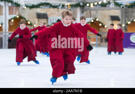 Choristers of Winchester Cathedral skate on the cathedral's ice rink, situated in the centre of the cathedral's Inner Close, which will be open from Thursday November 21 until Sunday January 5, 2020. Stock Photo