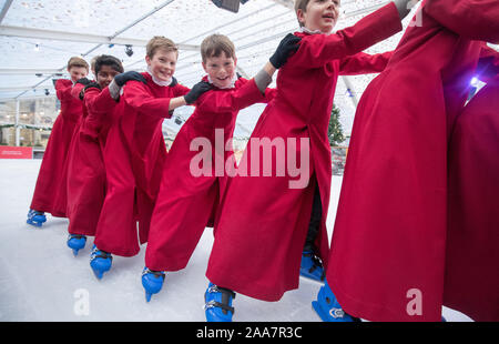 Choristers of Winchester Cathedral skate on the cathedral's ice rink, situated in the centre of the cathedral's Inner Close, which will be open from Thursday November 21 until Sunday January 5, 2020. Stock Photo