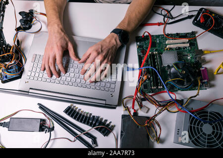 electronics technician working - testing and configuring computer hardware Stock Photo
