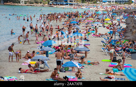 Overtourism. crowded beach in Santa Ponca, Mallorca, Baearic islands, Spain Stock Photo